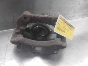 Used Front brake calliper, left Volkswagen Passat Variant (3B5) 1.8 20V Price on request offered by Akkie Stomphorst Autodemontage