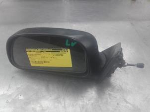 Used Wing mirror, left Mitsubishi Colt (CA/CC) 1.6 i GL,GLX 16V Price on request offered by Akkie Stomphorst Autodemontage