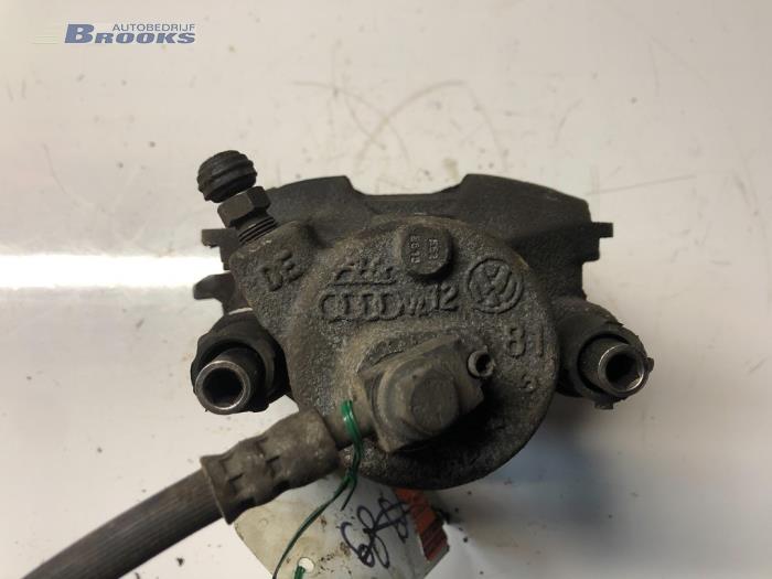 Front brake calliper, left from a Volkswagen Up! (121) 1.0 12V 75 2016