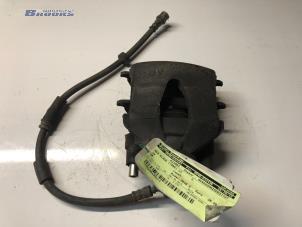 Used Front brake calliper, left Volkswagen Up! (121) 1.0 12V 75 Price € 28,00 Margin scheme offered by Autobedrijf Brooks