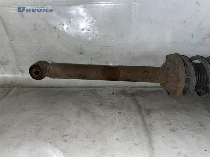 Rear shock absorber rod, left from a Ford Fiesta 4 1.3i 2002