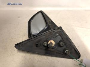 Used Wing mirror, right Nissan Sunny (N14) 1.4i 16V Price € 10,00 Margin scheme offered by Autobedrijf Brooks