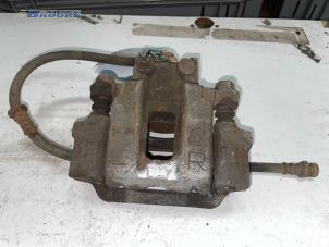 Used Rear brake calliper, left Mitsubishi Pajero Hardtop (V6/7) 3.2 DI-D 16V Autom. Price € 70,00 Margin scheme offered by Autobedrijf Brooks