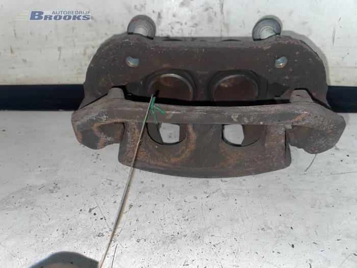 Front brake calliper, left from a Ford Transit 2.0 TDdi 16V 260S 2002
