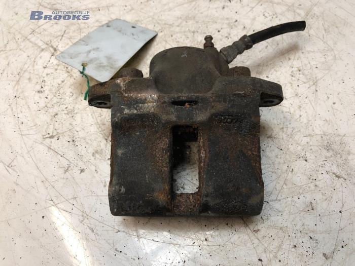 Front brake calliper, left from a Renault Clio (B/C57/357/557/577) 1.4 RN,RT,S,Autom.Kat. 1996