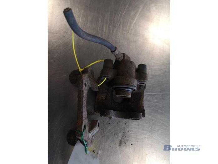 Rear brake calliper, left from a BMW 3 serie (E36/4) 325 td 1993