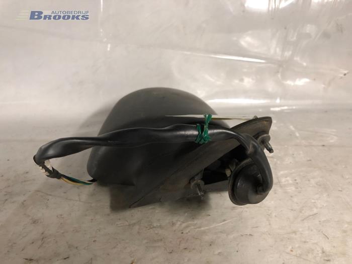 Wing mirror, left from a Chrysler Voyager/Grand Voyager 2.5 i S,SE 1994