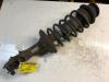 Front shock absorber rod, left from a Seat Ibiza II (6K1) 1.6i CLX,GLX,S,SXE 1996