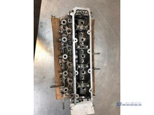 Used Cylinder head Peugeot 206 (2A/C/H/J/S) 2.0 XS,XT HDi Price € 175,00 Margin scheme offered by Autobedrijf Brooks