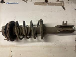 Used Front shock absorber rod, right Mazda 323 Price € 25,00 Margin scheme offered by Autobedrijf Brooks
