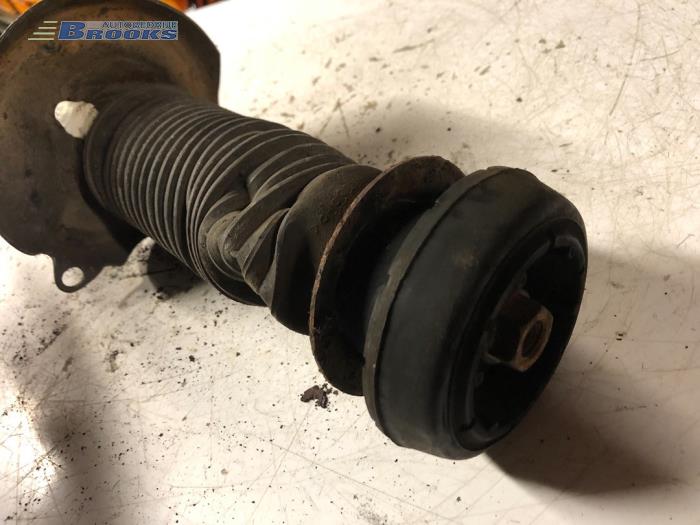 Front shock absorber rod, left from a Volkswagen Golf III (1H1) 1.6 i 1994