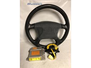 Used Left airbag (steering wheel) Mazda 323 Fastbreak (BJ14) 1.5 LX,GLX 16V Price € 25,00 Margin scheme offered by Autobedrijf Brooks