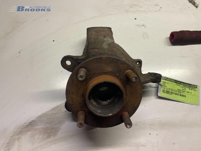 Knuckle, front left from a Ford Escort 5 (AAL/ABL) 1.8i 16V (E2) 1994