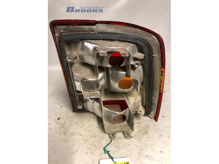 Taillight, left from a Opel Vectra A (88/89) 1.8 i 1992