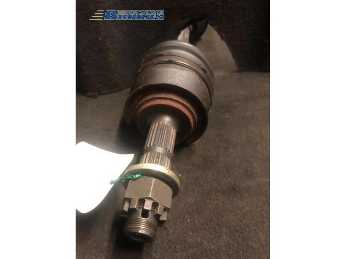 Front drive shaft, left from a Opel Corsa 1998