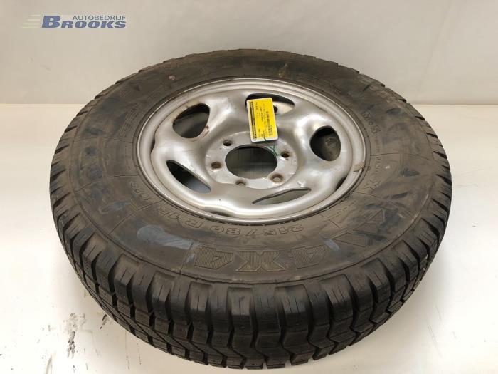 Wheel + tyre from a Ford Maverick 1994