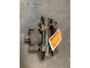 Used Front brake calliper, left Opel Astra F (56/57) 1.7 D GL/GLS Price € 15,00 Margin scheme offered by Autobedrijf Brooks
