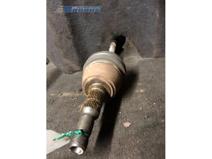 Front drive shaft, left from a Opel Astra 1999
