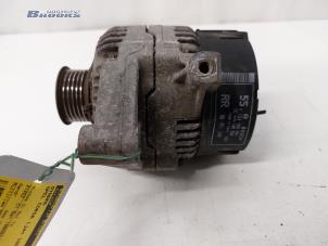 Dynamo van een Opel Corsa B (73/78/79) 1.4i 1998