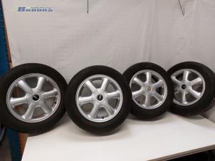 Usagé Jeu de jantes sport + pneus Mini Mini (R56) 1.6 16V Cooper Prix € 125,00 Règlement à la marge proposé par Autobedrijf Brooks