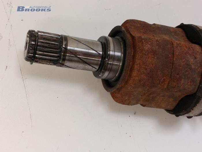 Front drive shaft, left from a Opel Corsa D 1.4 16V Twinport 2011