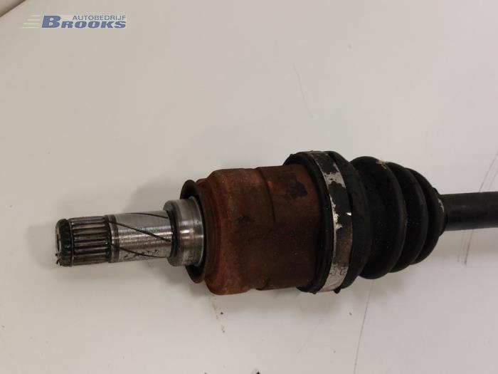 Front drive shaft, left from a Opel Corsa D 1.2 16V 2009