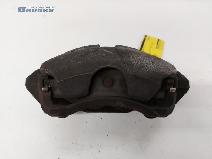 Front brake calliper, left from a Volkswagen Golf VII (AUA) 1.6 TDI BlueMotion 16V 2014