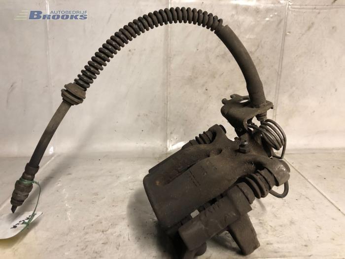 Rear brake calliper, left from a Volkswagen Caddy IV 2.0 TDI 102 2019