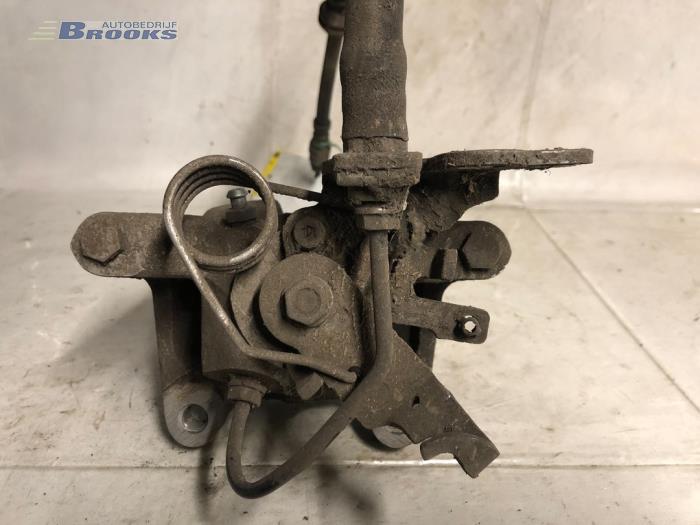 Rear brake calliper, left from a Volkswagen Caddy IV 2.0 TDI 102 2019