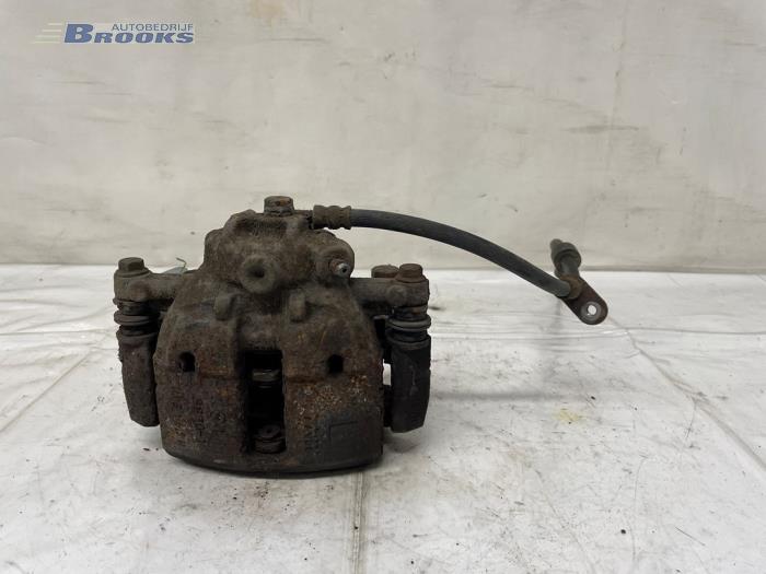 Gebrauchte Bremszange links vorne Mitsubishi Colt (Z2/Z3) 1.3 16V Preis € 15,00 Margenregelung angeboten von Autobedrijf Brooks