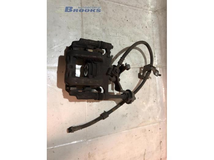 Rear brake calliper, left from a Opel Astra J Sports Tourer (PD8/PE8/PF8) 1.6 CDTI 16V 2015