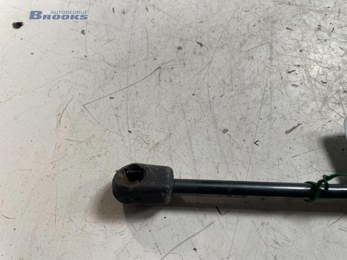 Rear gas strut, left from a Ford KA 1999
