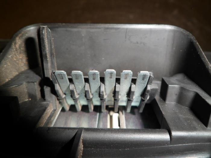 Tail light bulb cover holder