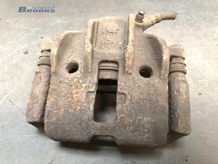 Front brake calliper, left from a Peugeot Partner 1.9 D 1999