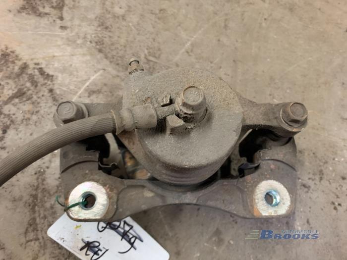 Front brake calliper, left from a Daewoo Lacetti (KLAN) 1.4 16V 2004