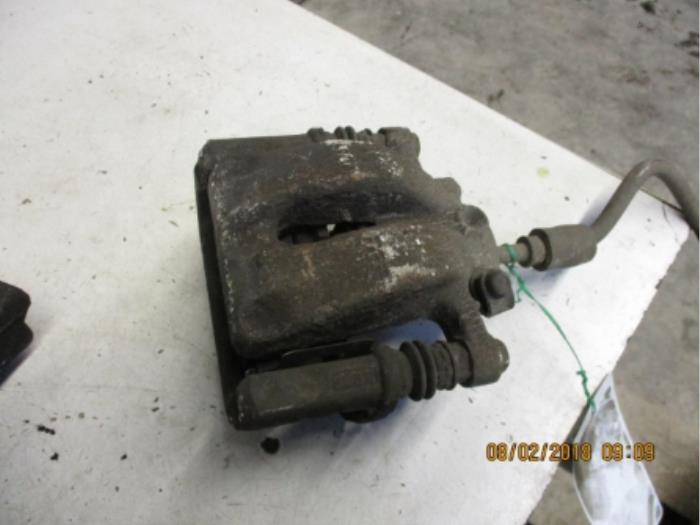 Rear brake calliper, left from a BMW 1 serie (E87/87N) 118i 16V 2005