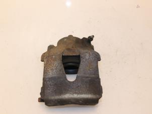 Used Front brake calliper, left Volkswagen Up! (121) 1.0 12V 60 Price € 30,00 Margin scheme offered by Van Gils Automotive