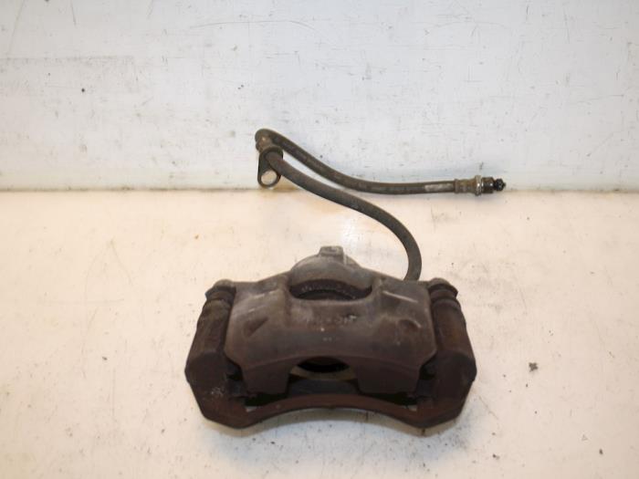Front brake calliper, left from a Peugeot 107  2010