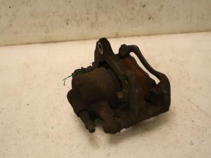 Used Front brake calliper, left Opel Corsa D 1.2 16V Price € 30,00 Margin scheme offered by Van Gils Automotive