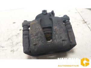 Used Front brake calliper, left Opel Corsa D 1.2 16V Price € 30,00 Margin scheme offered by Van Gils Automotive