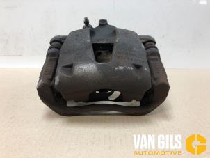 Used Front brake calliper, right Opel Corsa D 1.2 16V Price on request offered by Van Gils Automotive
