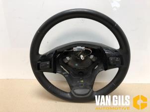 Used Steering wheel Opel Corsa D 1.4 16V Twinport LPG Price on request offered by Van Gils Automotive