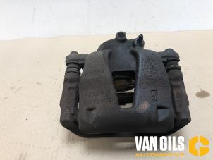 Used Front brake calliper, left Opel Corsa D 1.4 16V Twinport Price € 55,00 Margin scheme offered by Van Gils Automotive