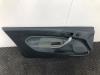 Tapizado de puerta de 2 puertas izquierda de un Ford Fiesta 6 (JA8) 1.25 16V 2011