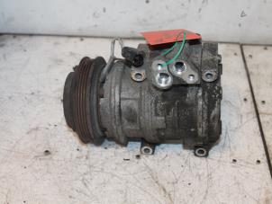 Used Air conditioning pump Kia Carnival 1 (FLB) 2.9 TD 16V Price € 75,00 Margin scheme offered by Van Gils Automotive