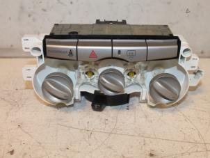 Usados Panel de control de calefacción Daihatsu Sirion 2 (M3) 1.0 12V DVVT Precio € 30,00 Norma de margen ofrecido por Van Gils Automotive