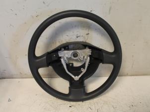 Used Steering wheel Daihatsu Sirion 2 (M3) 1.0 12V DVVT Price € 77,00 Margin scheme offered by Van Gils Automotive