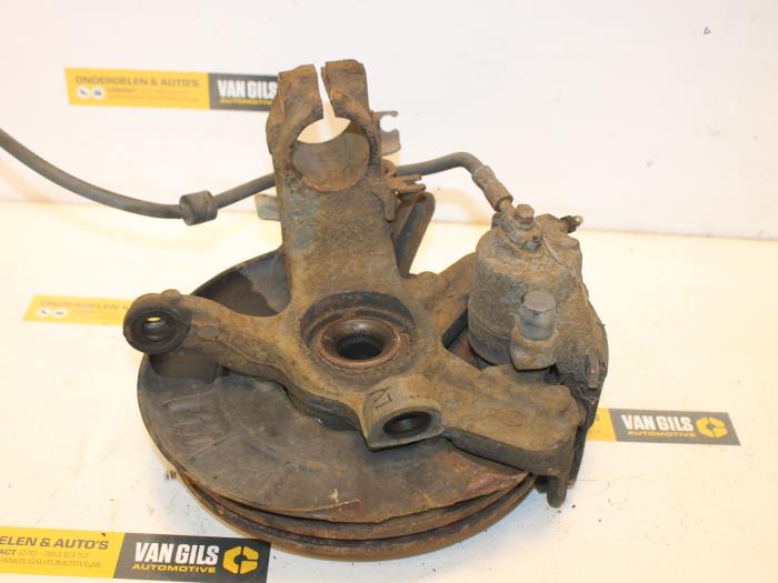 Knuckle, front left from a Seat Ibiza III (6L1) 1.2 12V 2005