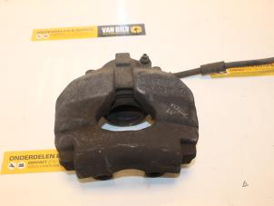 Used Front brake calliper, left Volkswagen Transporter T5 1.9 TDi Price € 43,00 Margin scheme offered by Van Gils Automotive