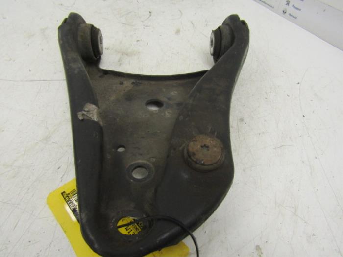 Front wishbone, left from a Renault Twingo II (CN) 1.2 16V LEV 2011